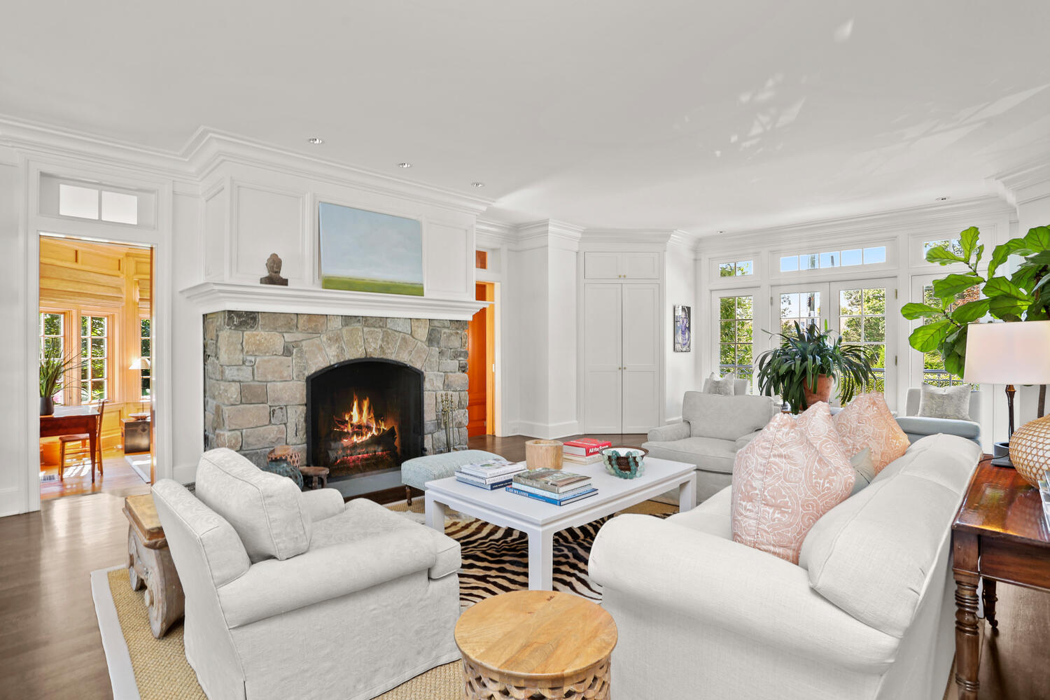 43 Contentment Island Road Darien, CT 06820 - Photo 7 of 59 a living room with furniture and a fireplace