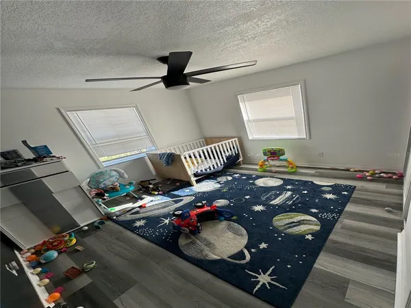 a living room with furniture and a rug