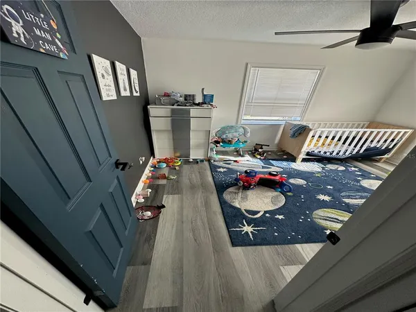 a bedroom with furniture and a window