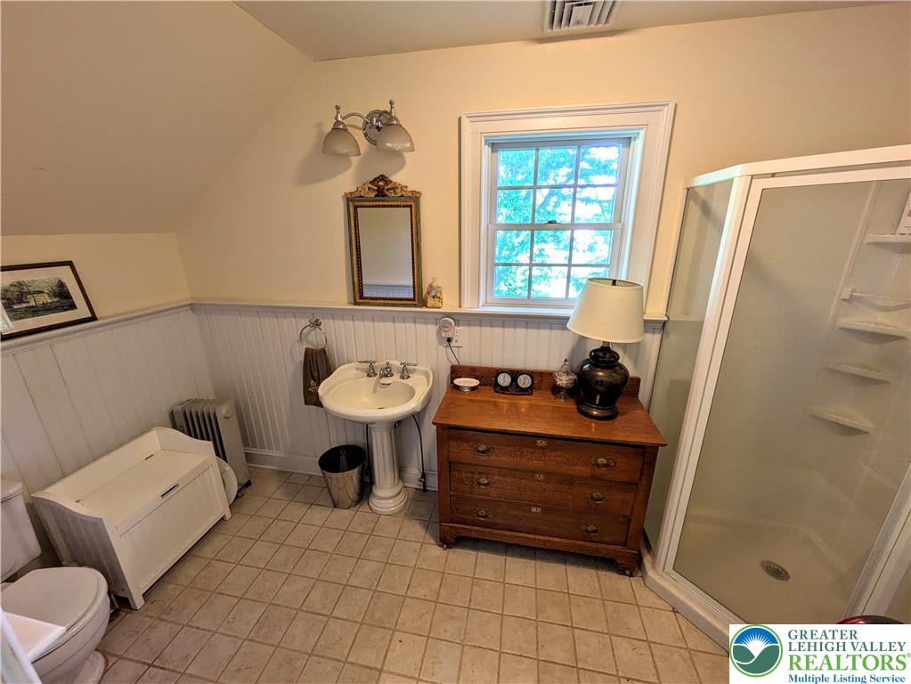1731 Howell Road Easton, PA 18040 - Photo 39 of 60 Sloped ceilings and timeless wainscoting bring classic architectural character to this bathroom space.