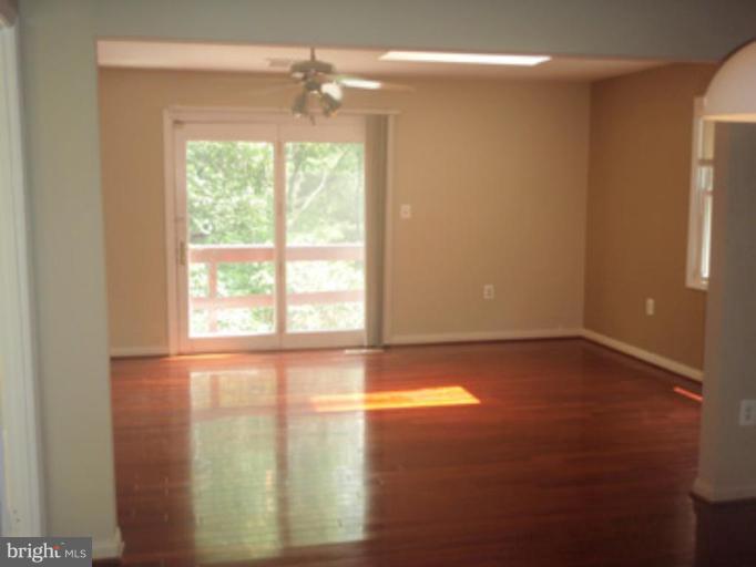 1803 Post Oak Trail Reston, VA 20191 - Photo 5 of 17 a view of an empty room with a window
