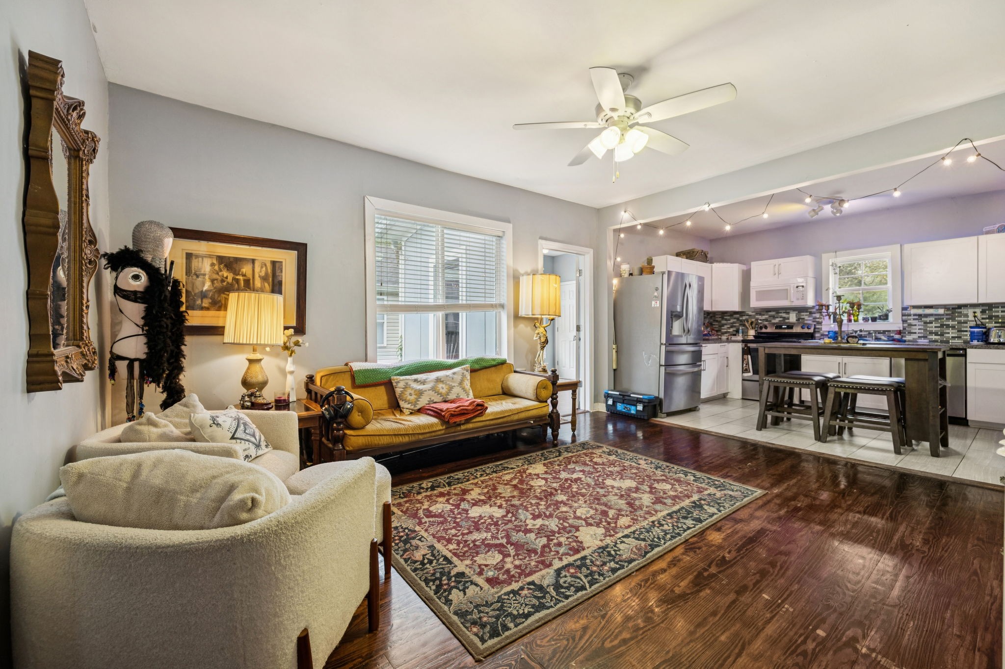 1007 Main Street Clarksville, TN 37040 - Photo 11 of 30 a living room with furniture and a chandelier