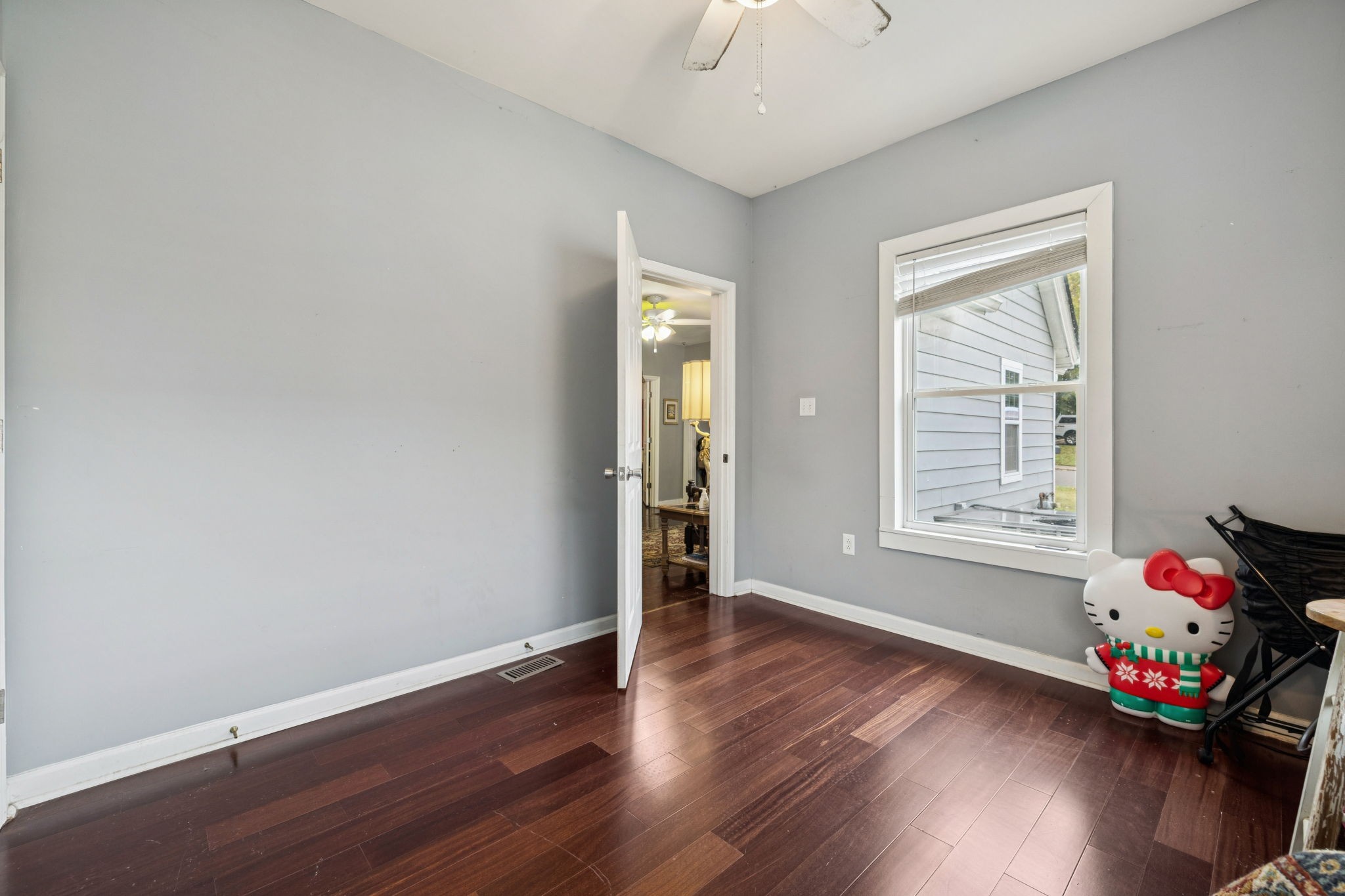 1007 Main Street Clarksville, TN 37040 - Photo 18 of 30 wooden floor in an empty room with a window