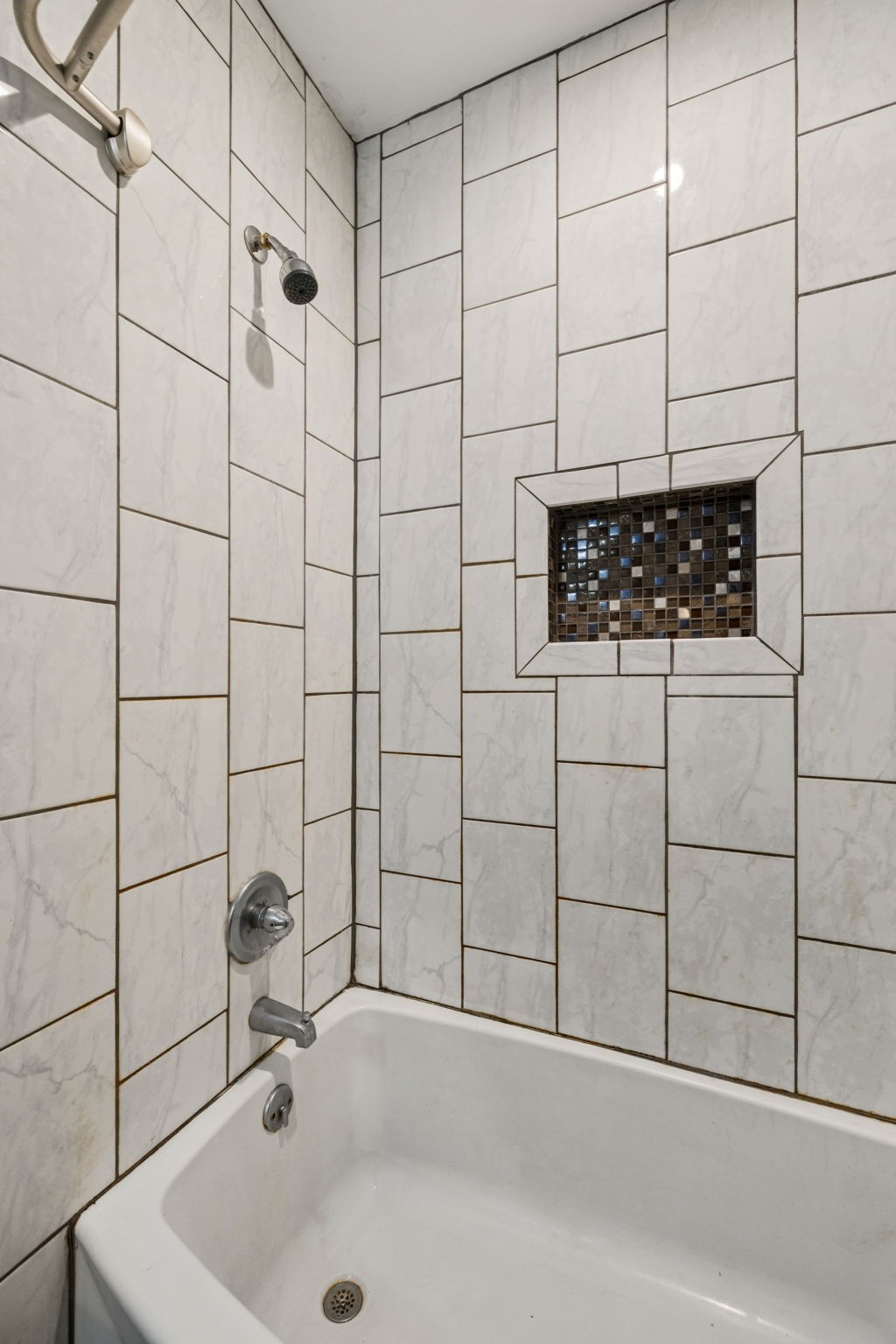 1007 Main Street Clarksville, TN 37040 - Photo 21 of 30 a bathroom with a sink and a shower