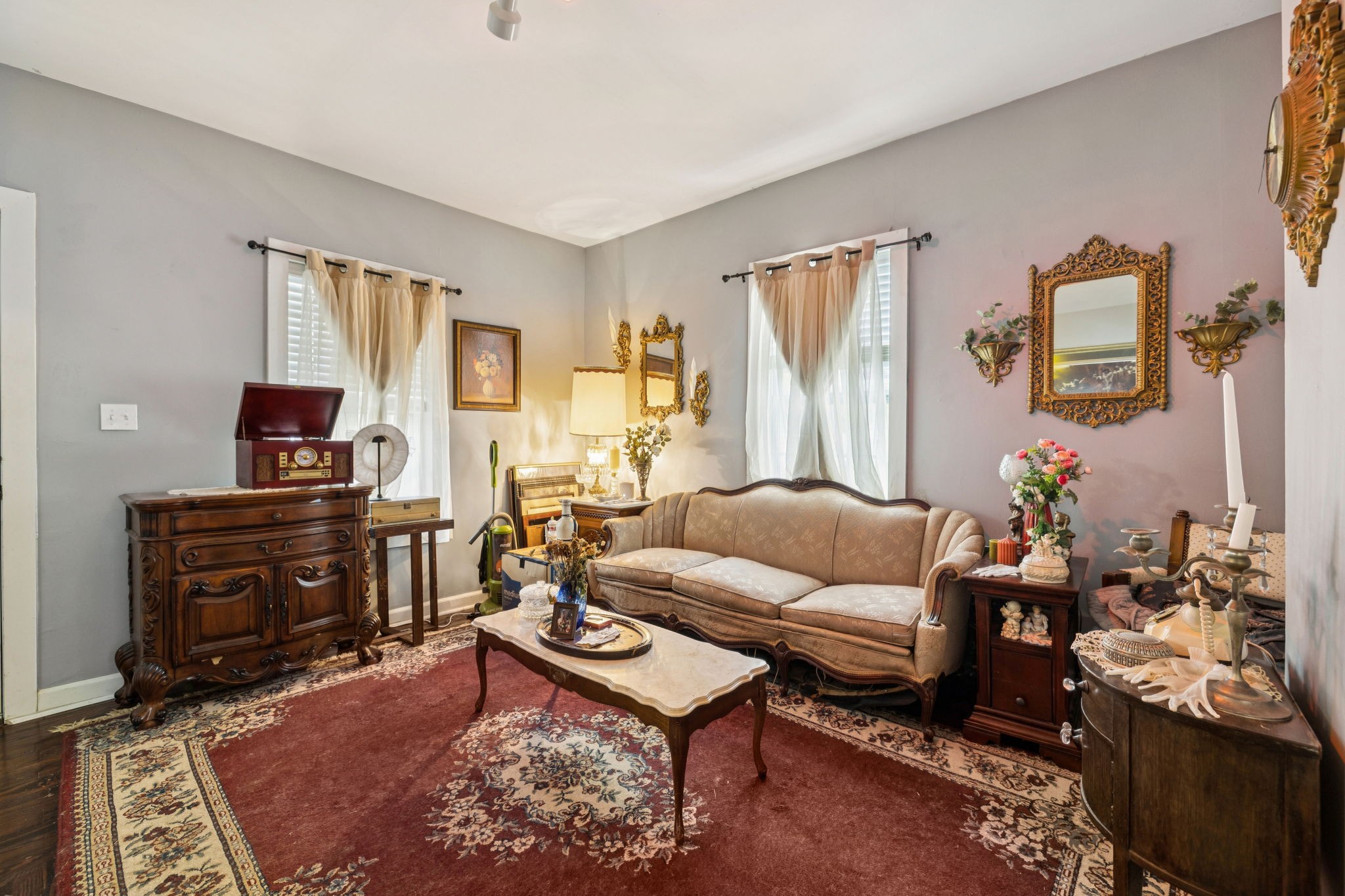 1007 Main Street Clarksville, TN 37040 - Photo 7 of 30 a living room with furniture a rug and a window