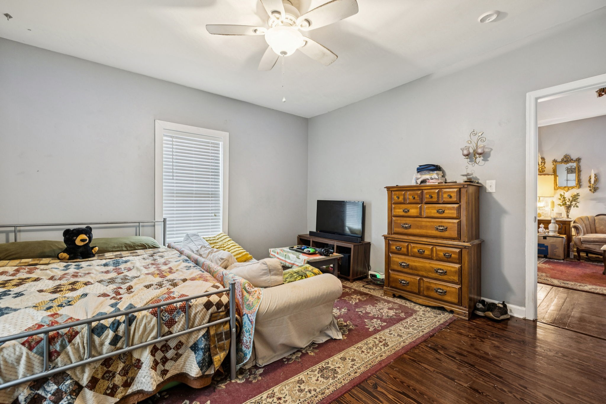 1007 Main Street Clarksville, TN 37040 - Photo 10 of 30 a bedroom with a bed and a television