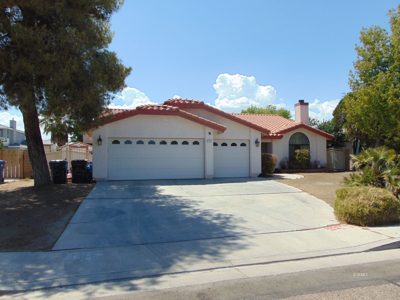 917 Carolyn Street Ridgecrest, CA 93555 - Photo 1 of 26 a front view of a house with a yard and garage