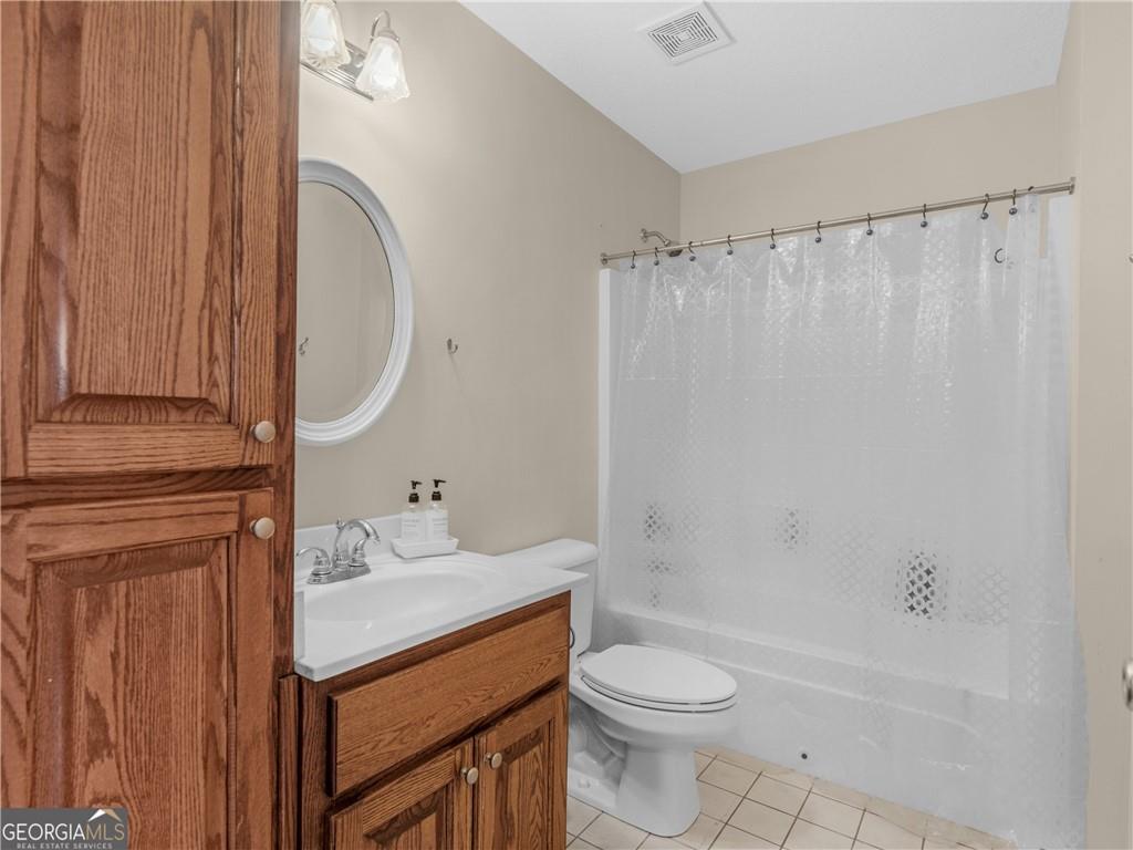 355 Parker Road Covington, GA 30014 - Photo 15 of 60 a bathroom with a sink a toilet and shower