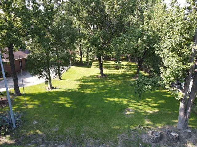 a swimming pool with outdoor seating and yard