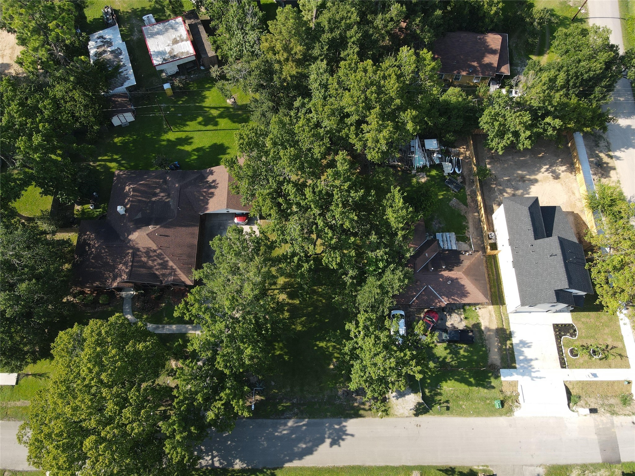 0 Caddo Road Houston, TX 77078 - Photo 6 of 6 an aerial view of a house with a yard lake and green space