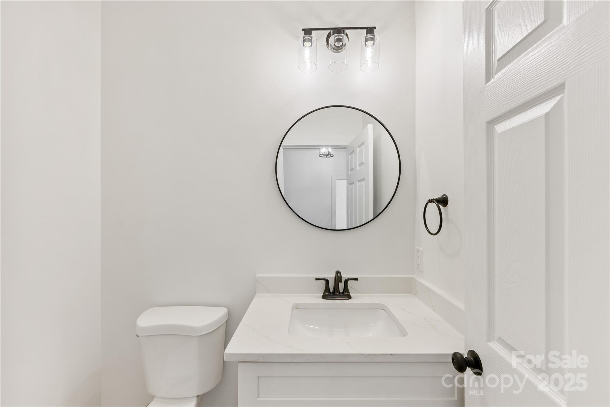 1871 Lynmore Drive Sherrills Ford, NC 28673 - Photo 16 of 40 a bathroom with a toilet a sink and a mirror