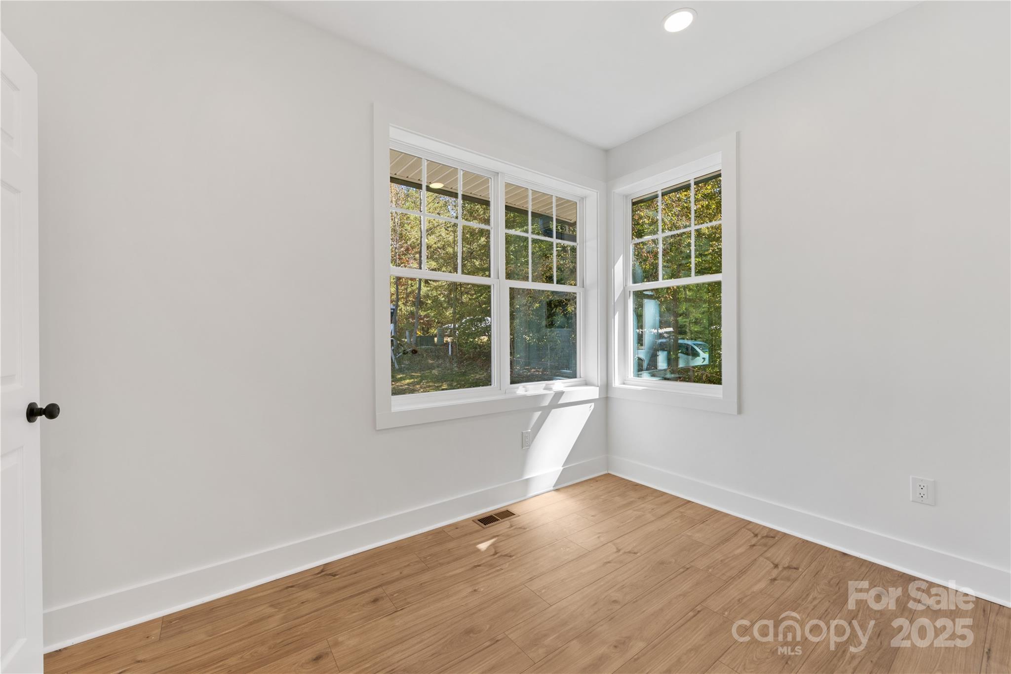 1871 Lynmore Drive Sherrills Ford, NC 28673 - Photo 18 of 40 an empty room with wooden floor and windows