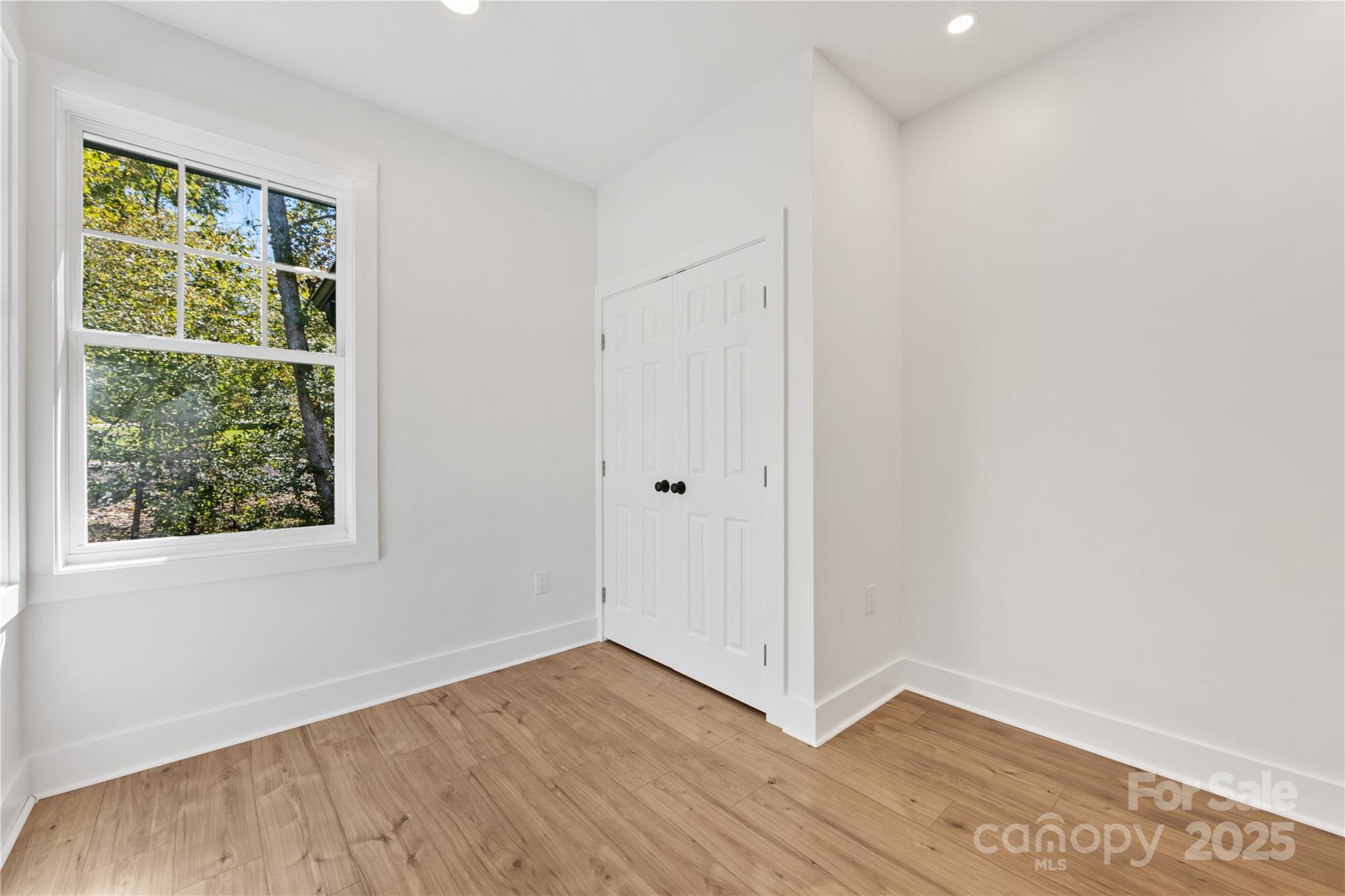 1871 Lynmore Drive Sherrills Ford, NC 28673 - Photo 19 of 40 a view of an empty room with wooden floor and a window