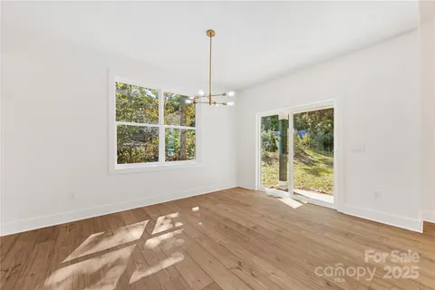 a view of an empty room with windows