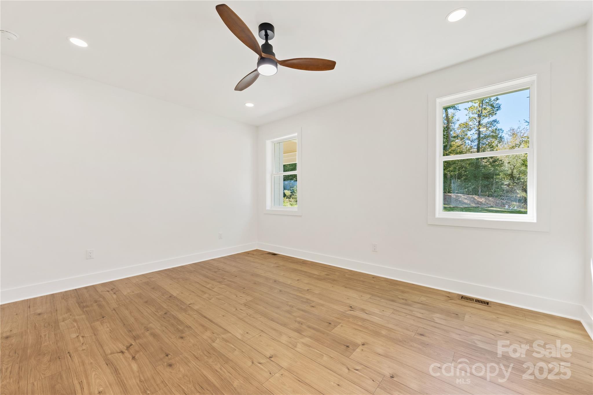 1871 Lynmore Drive Sherrills Ford, NC 28673 - Photo 23 of 40 a view of a big room with wooden floor and a window