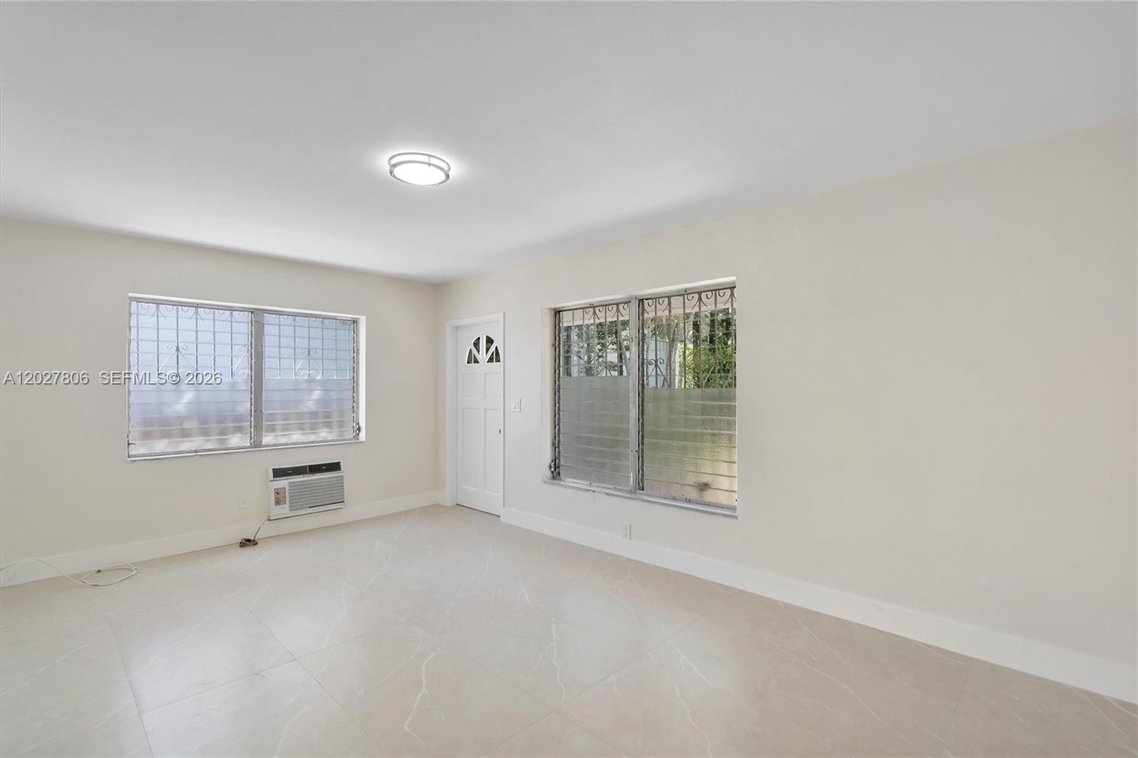 1612 Southwest 23rd Street, Unit 1612 Miami, FL 33145 - Photo 7 of 42 a view of an empty room with a window