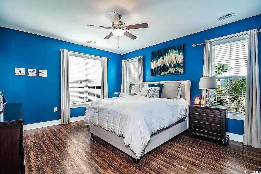 399 Lumbee Circle Pawleys Island, SC 29585 - Photo 15 of 30 Bedroom featuring dark wood-style floors and ceiling fan