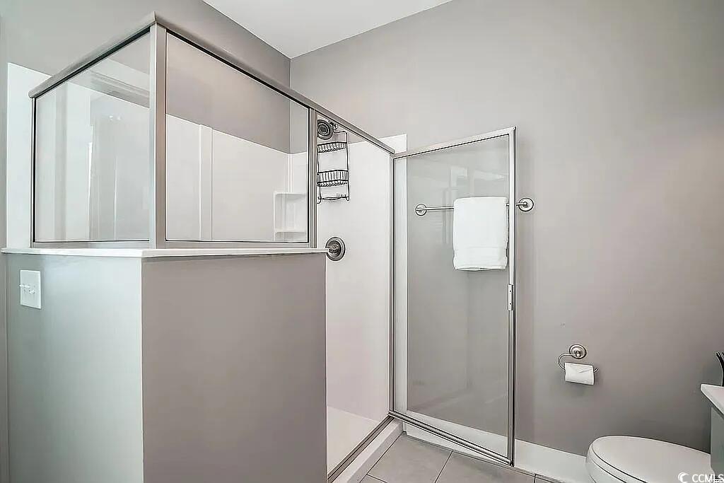 399 Lumbee Circle Pawleys Island, SC 29585 - Photo 18 of 30 Full bath with a stall shower and light tile patterned flooring