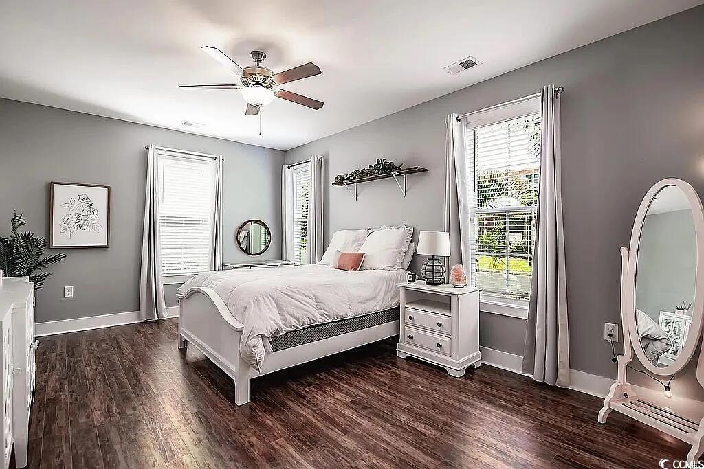 399 Lumbee Circle Pawleys Island, SC 29585 - Photo 20 of 30 Bedroom with dark wood finished floors and ceiling fan