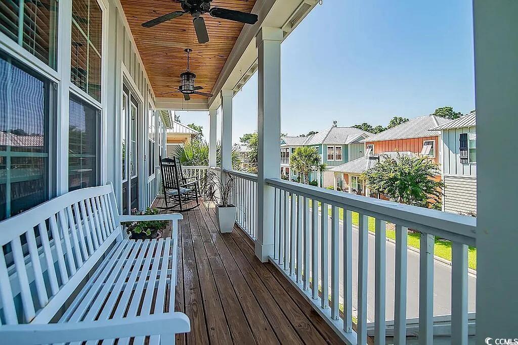 399 Lumbee Circle Pawleys Island, SC 29585 - Photo 2 of 30 Wooden deck with ceiling fan and a residential view