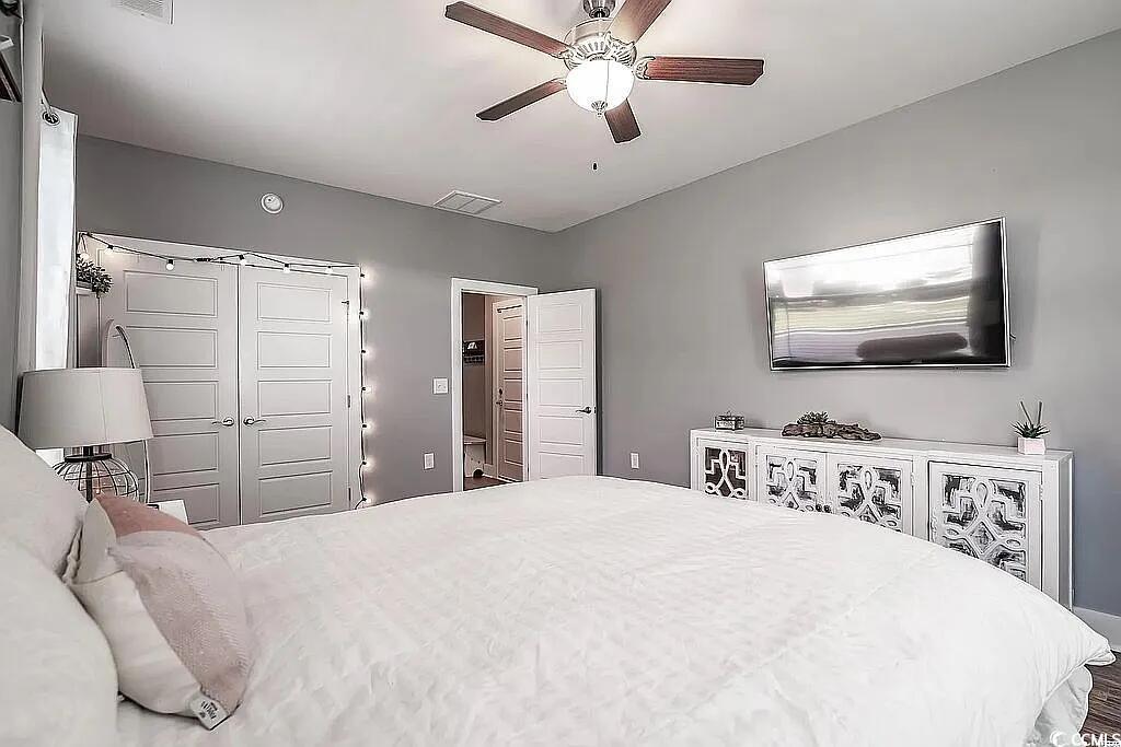 399 Lumbee Circle Pawleys Island, SC 29585 - Photo 21 of 30 Bedroom featuring a closet and ceiling fan