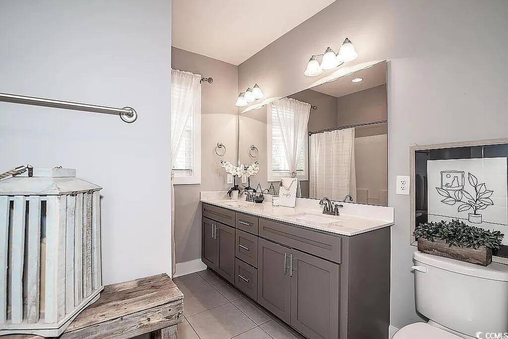 399 Lumbee Circle Pawleys Island, SC 29585 - Photo 25 of 30 Bathroom featuring light tile patterned flooring and double vanity
