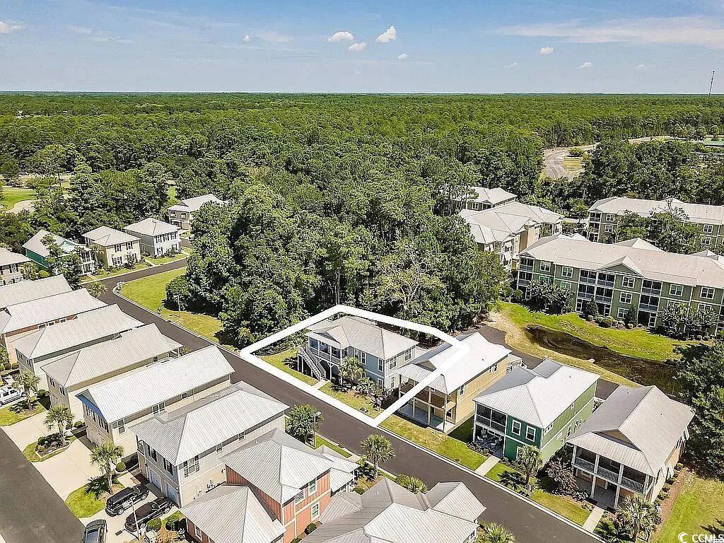 399 Lumbee Circle Pawleys Island, SC 29585 - Photo 27 of 30 Aerial perspective of suburban area featuring a heavily wooded area