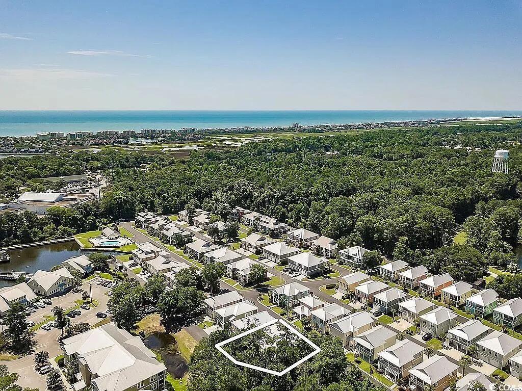 399 Lumbee Circle Pawleys Island, SC 29585 - Photo 30 of 30 Aerial view of residential area featuring a nearby body of water