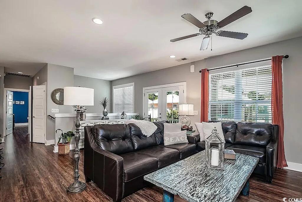 399 Lumbee Circle Pawleys Island, SC 29585 - Photo 3 of 30 Living area with plenty of natural light, dark wood-style flooring, recessed lighting, ceiling fan, and french doors