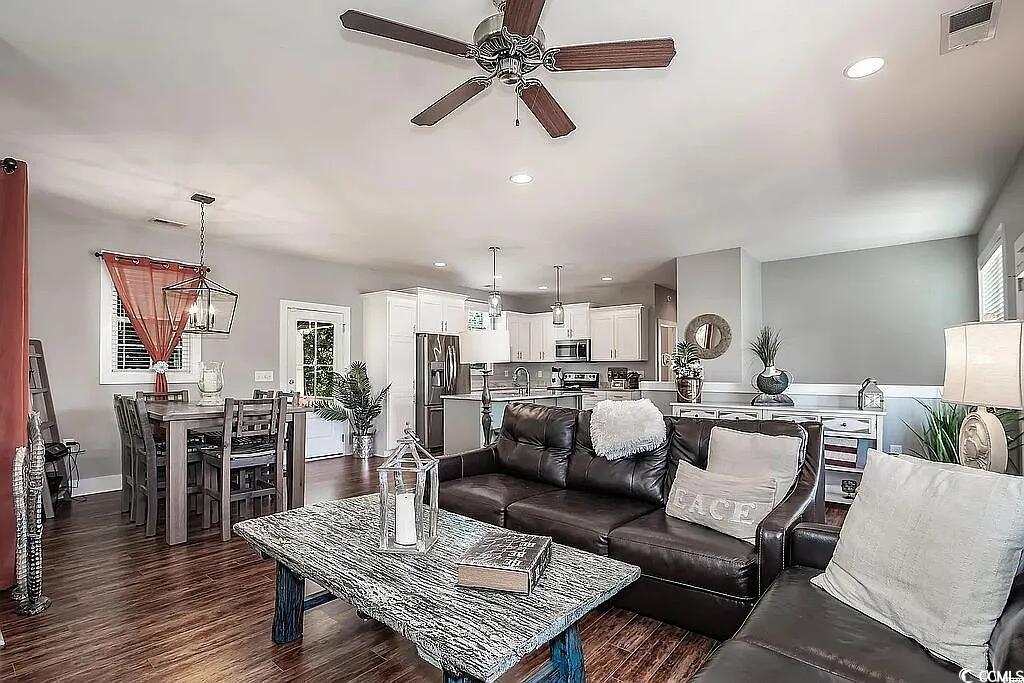 399 Lumbee Circle Pawleys Island, SC 29585 - Photo 7 of 30 Living area with dark wood-style floors, recessed lighting, and a ceiling fan
