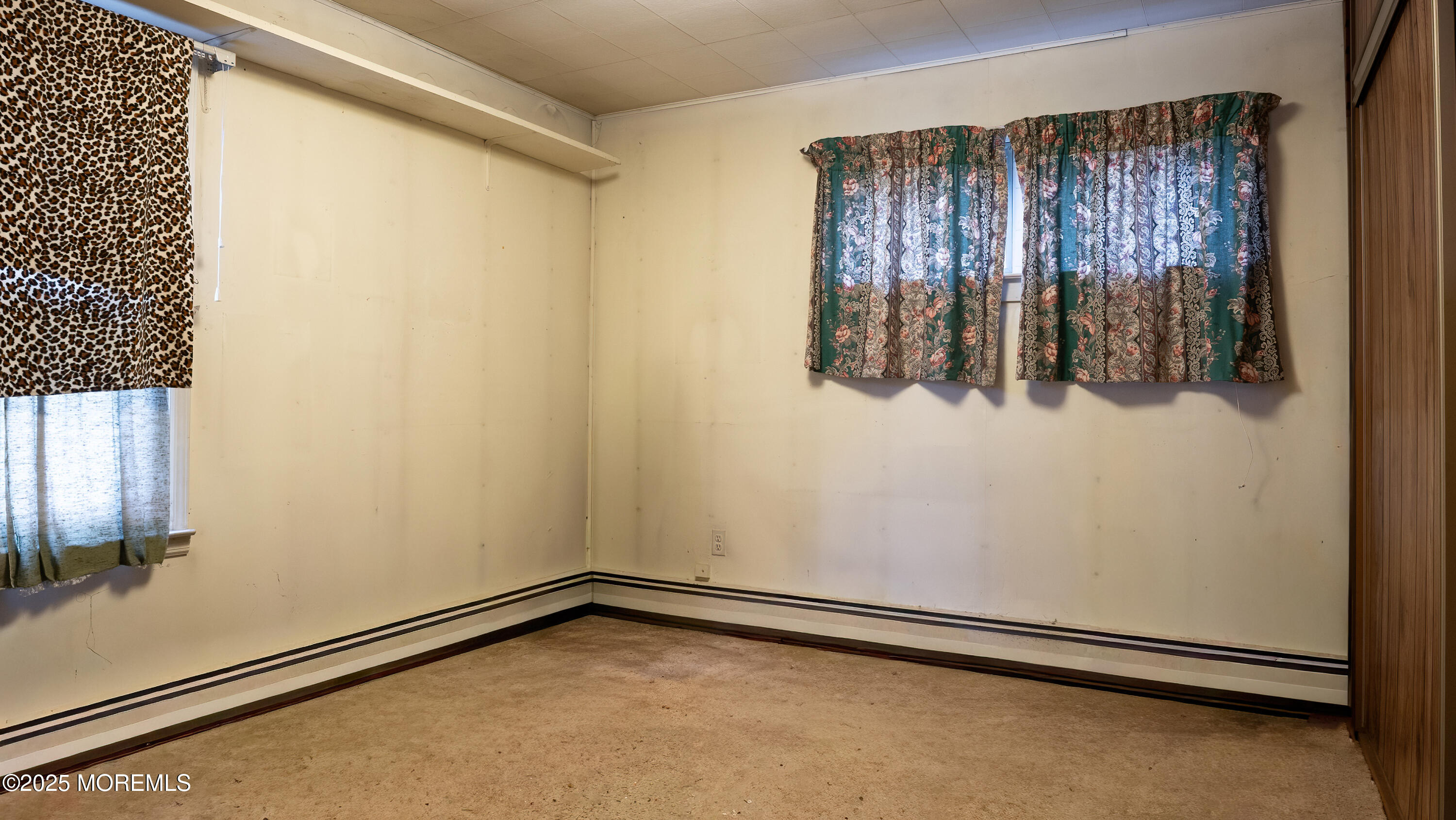 219 Kettle Creek Road Toms River, NJ 08753 - Photo 20 of 26 a view of a closet with wooden floor