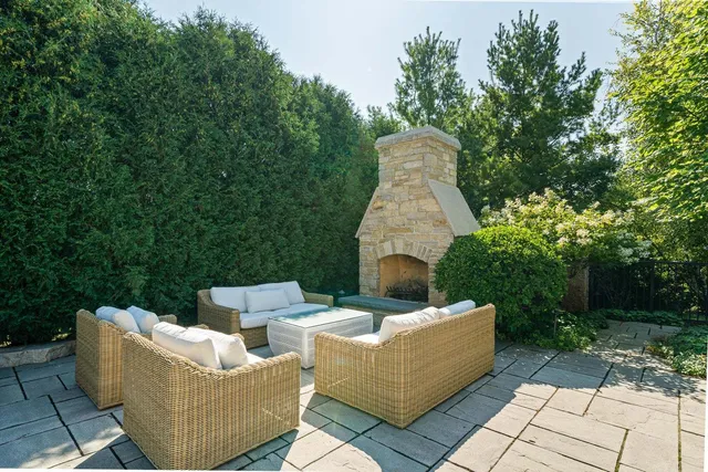 a view of a patio with table and chairs and a potted plant