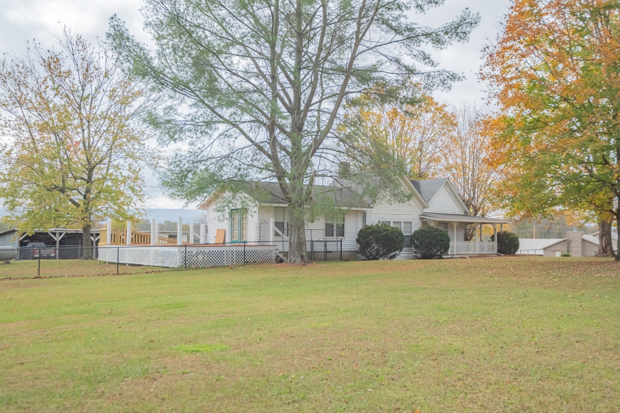 21 River End Road Pelham, TN 37366 - Photo 4 of 40 a view of a house with a big yard and large trees