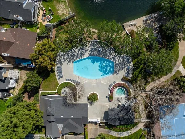 an aerial view of a house with garden space swimming pool and outdoor seating