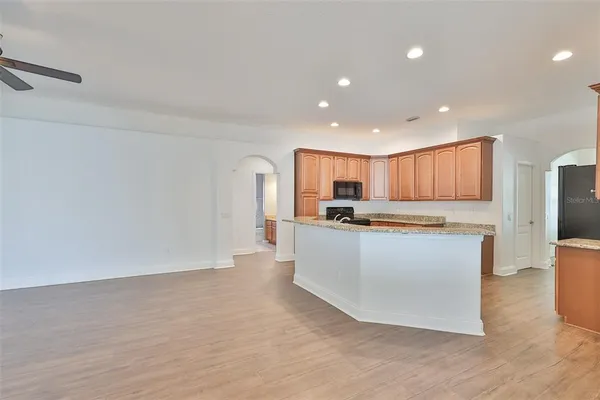 a view of kitchen with stainless steel appliances cabinets