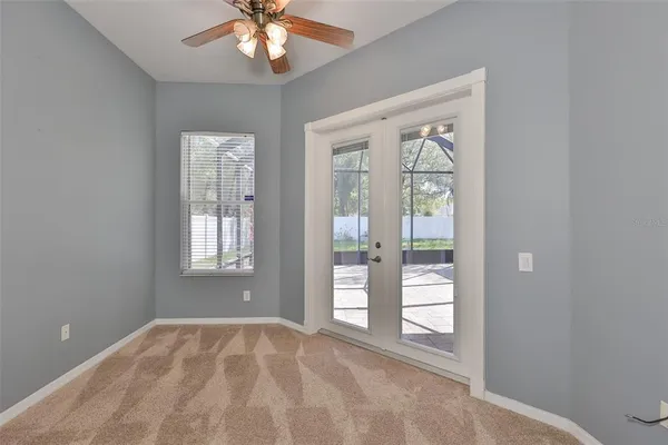 a view of an empty room with a window