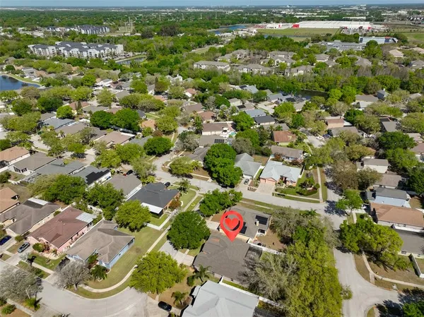 an aerial view of residential houses with outdoor space