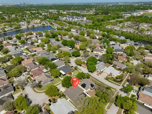 an aerial view of residential houses with outdoor space