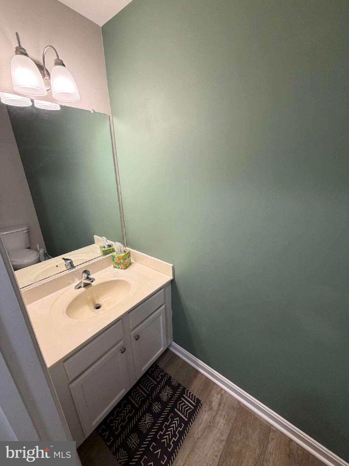 313 3rd Street Colonial Beach, VA 22443 - Photo 7 of 36 Chic bathroom with calming green hues.