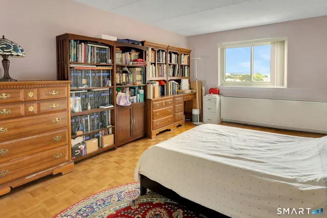 a bedroom with a bed and closet