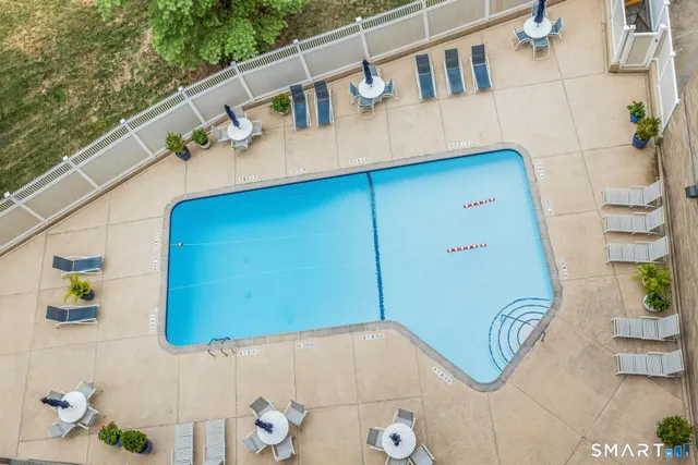 a roof deck with potted plants