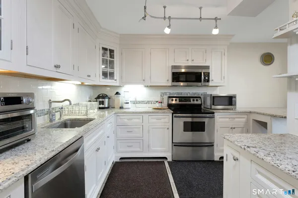 a kitchen with a stove and a sink
