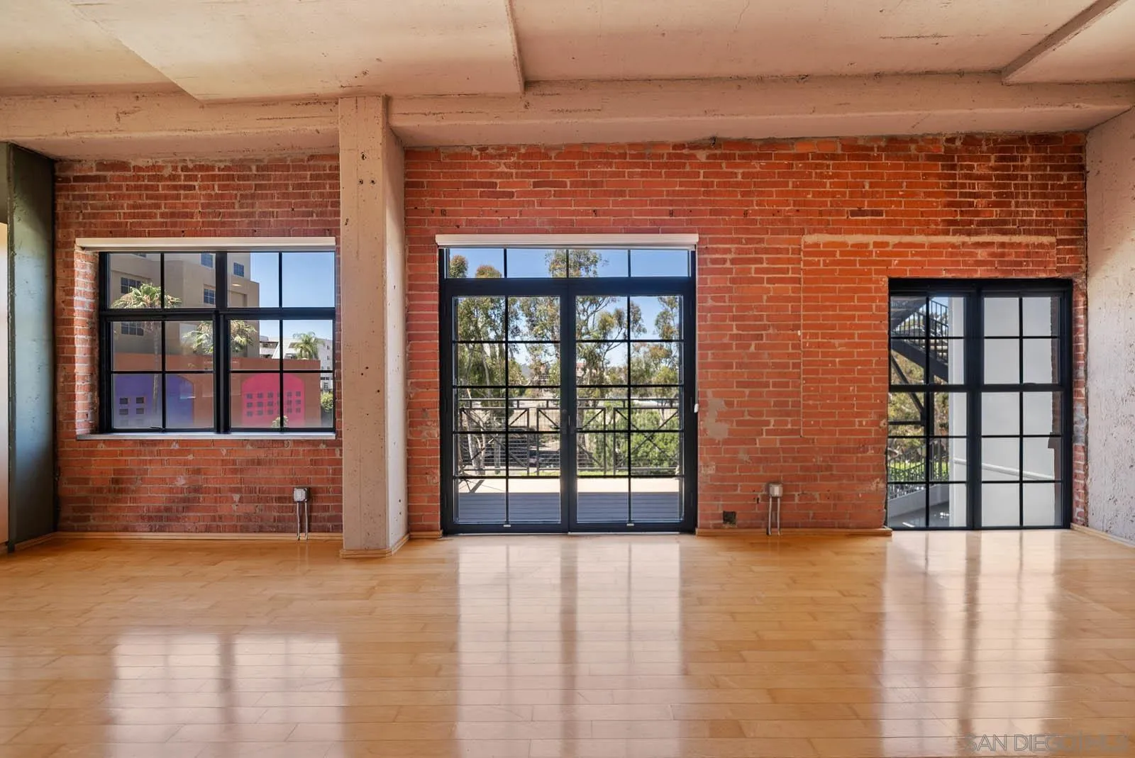 3940 7th Avenue, Unit 206 San Diego, CA 92103 - Photo 12 of 54 a view of a brick house with a large window