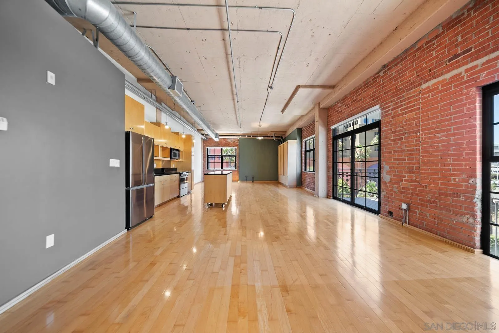 3940 7th Avenue, Unit 206 San Diego, CA 92103 - Photo 14 of 54 a view of a hallway with wooden floor