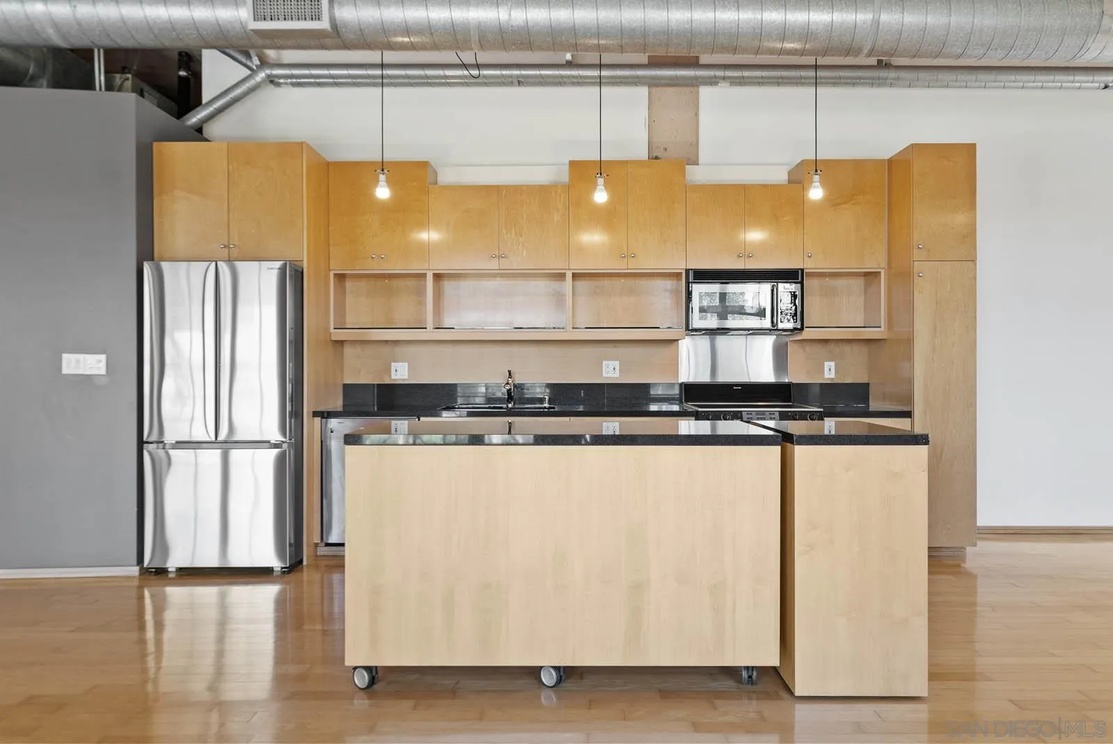3940 7th Avenue, Unit 206 San Diego, CA 92103 - Photo 22 of 54 a kitchen with stainless steel appliances granite countertop a refrigerator and a stove