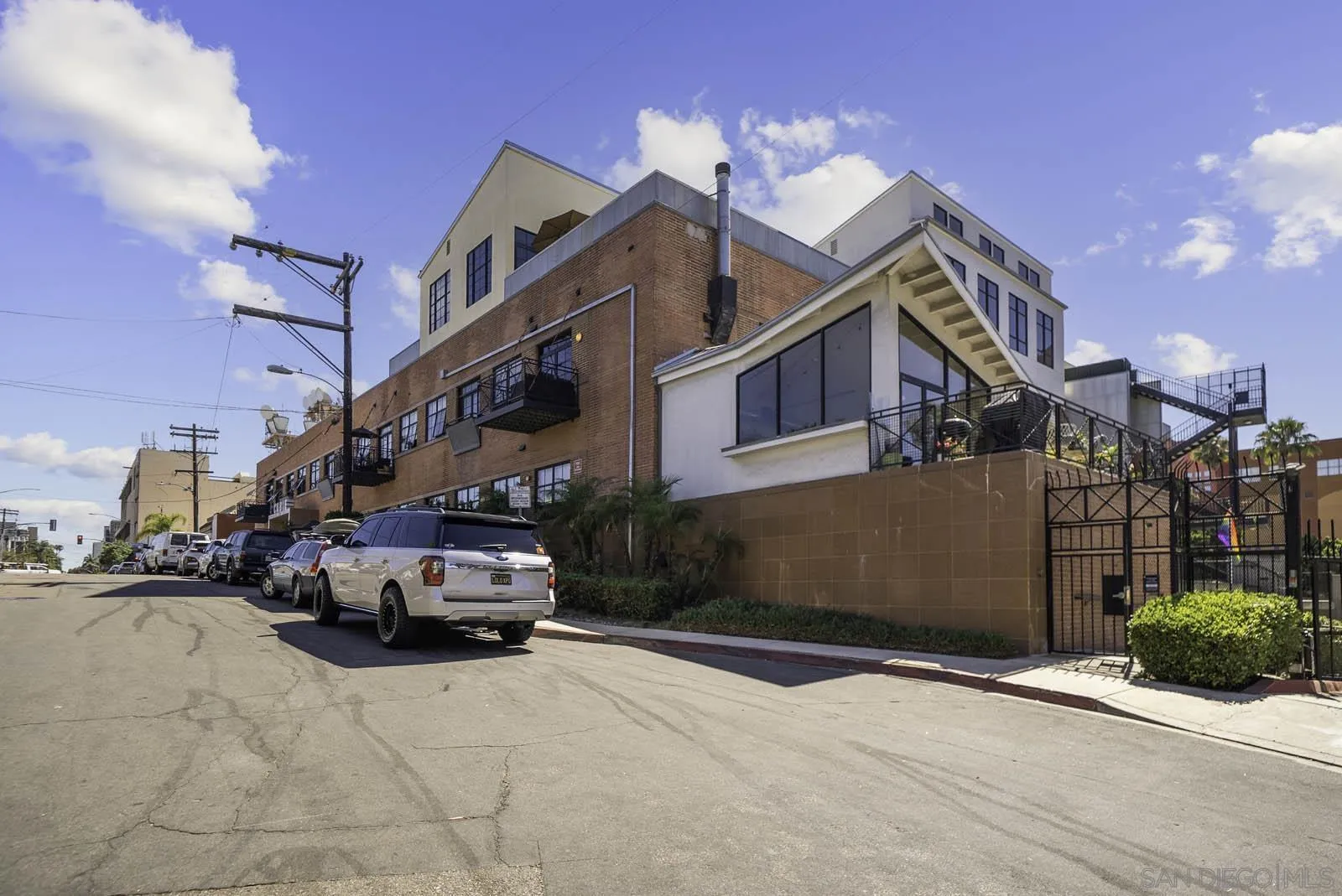 3940 7th Avenue, Unit 206 San Diego, CA 92103 - Photo 46 of 54 a car parked in front of a building