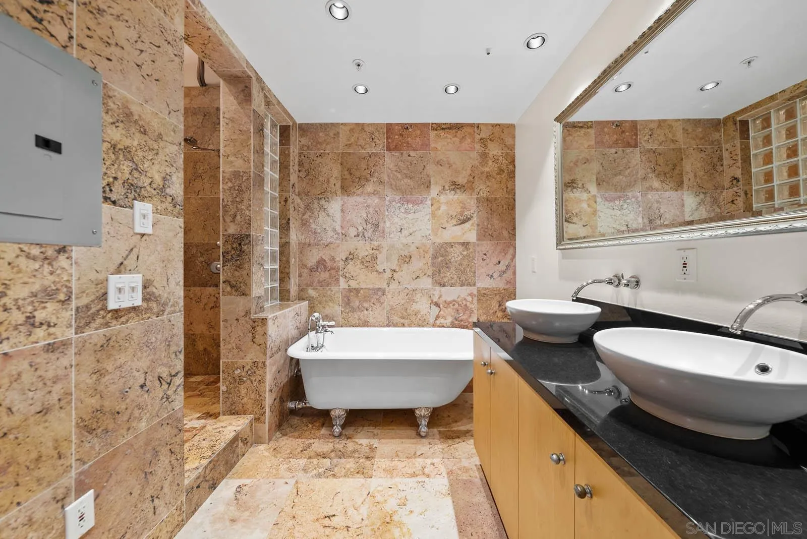 3940 7th Avenue, Unit 206 San Diego, CA 92103 - Photo 49 of 54 a bathroom with a granite countertop sink and a mirror