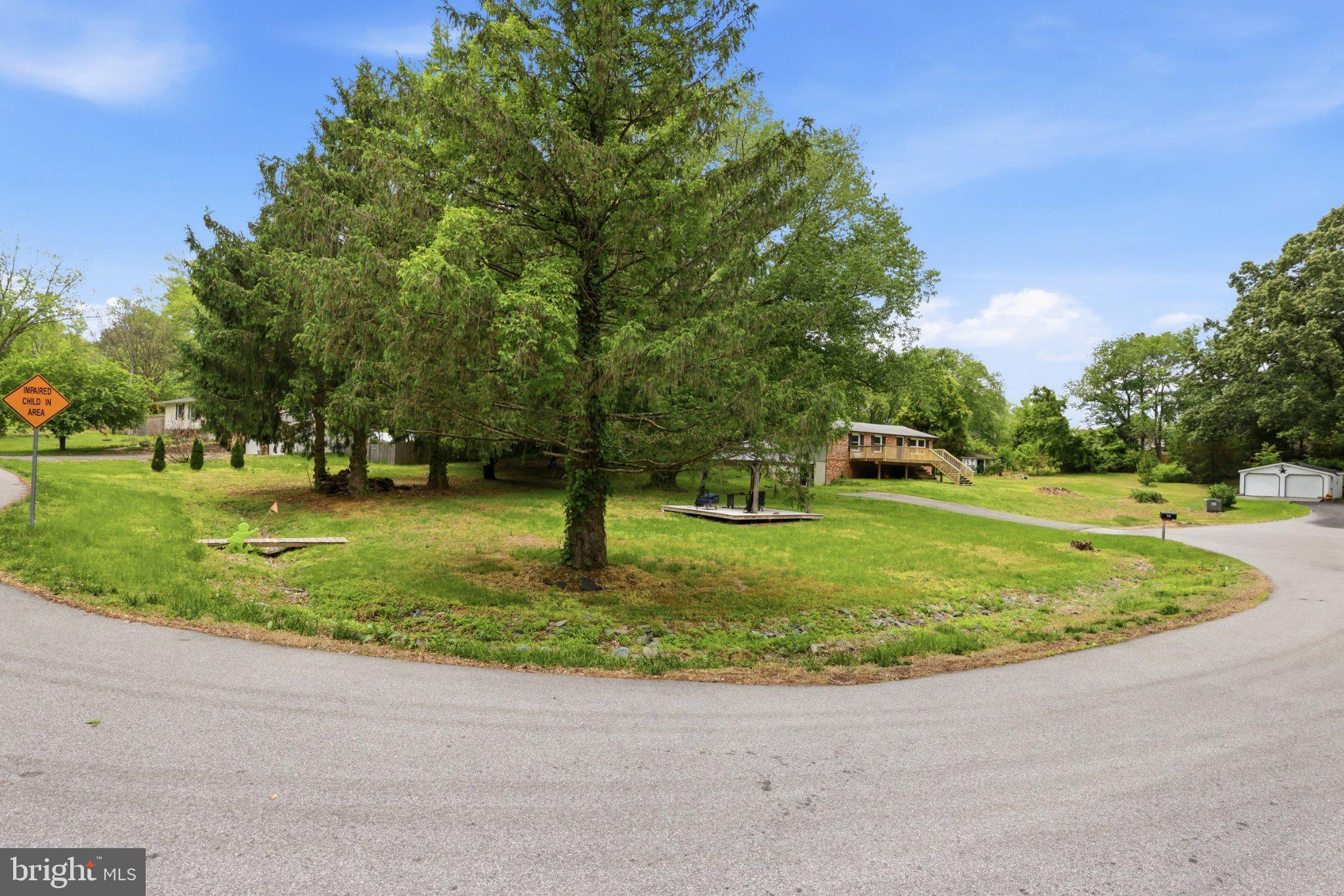 941 Pat Lane Huntingtown, MD 20639 - Photo 2 of 30 Serene corner lot with lush greenery.