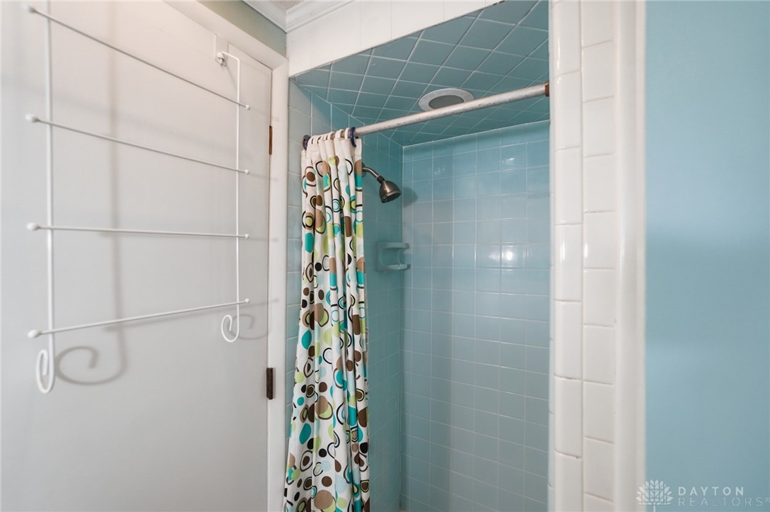 6119 Flemington Road Dayton, OH 45459 - Photo 52 of 76 This clean bathroom features a shower with tiled walls and a functional shower head.