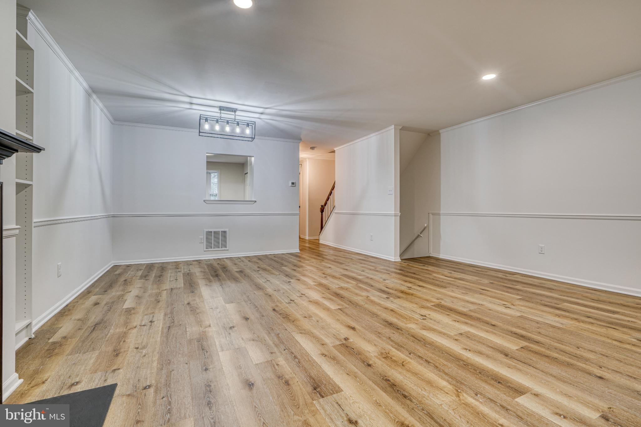 7233 Brookfalls Terrace Baltimore, MD 21209 - Photo 7 of 26 a view of empty room with wooden floor